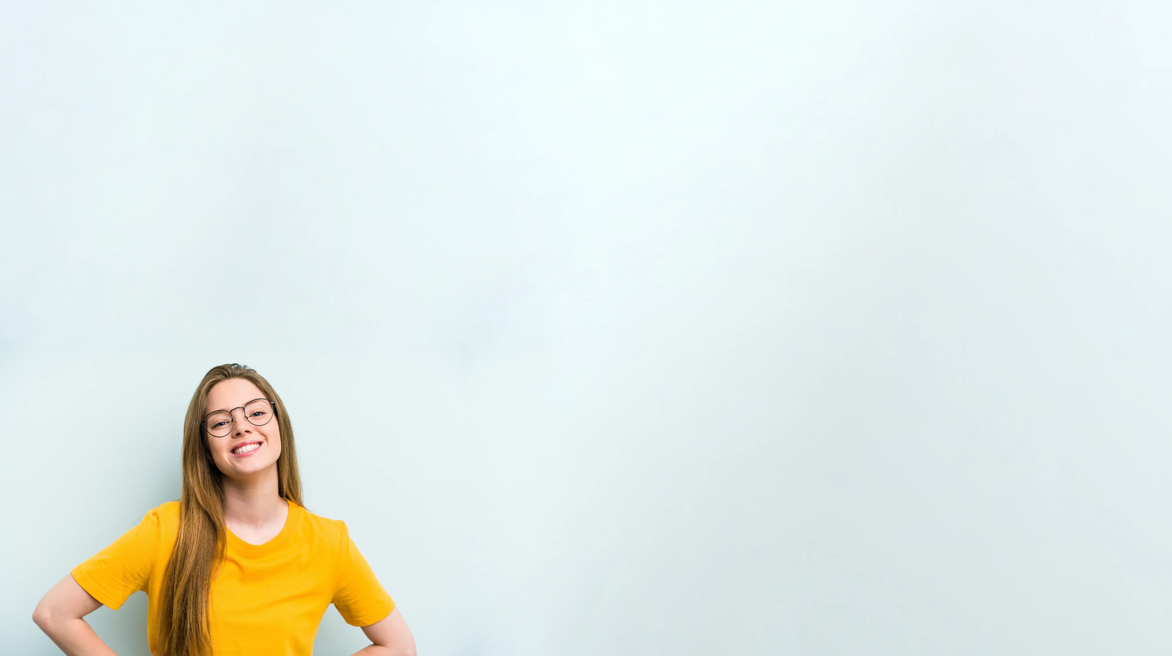Smiling young woman with glasses
